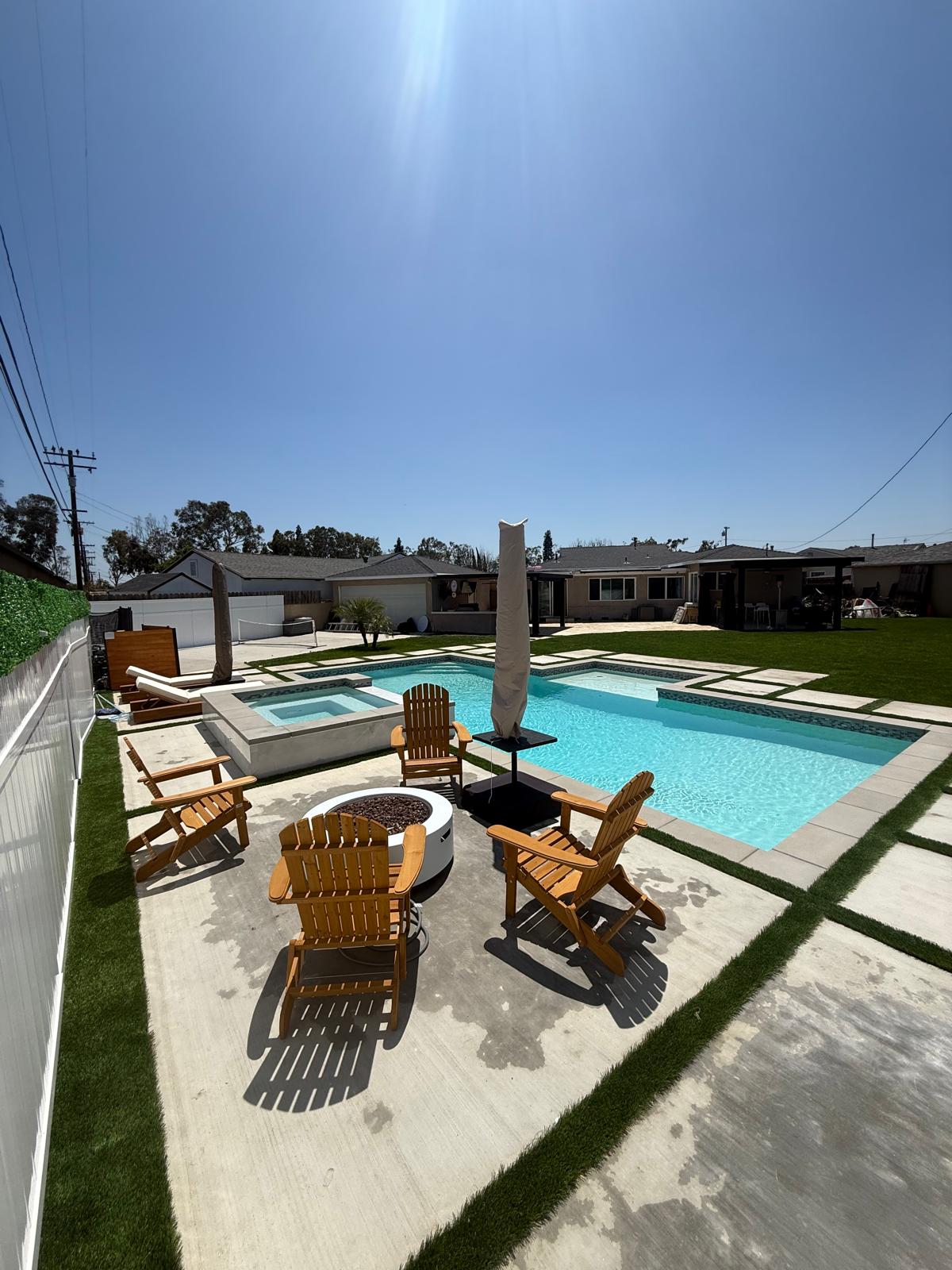 Pool with spa, fire pit and Adirondack chairs