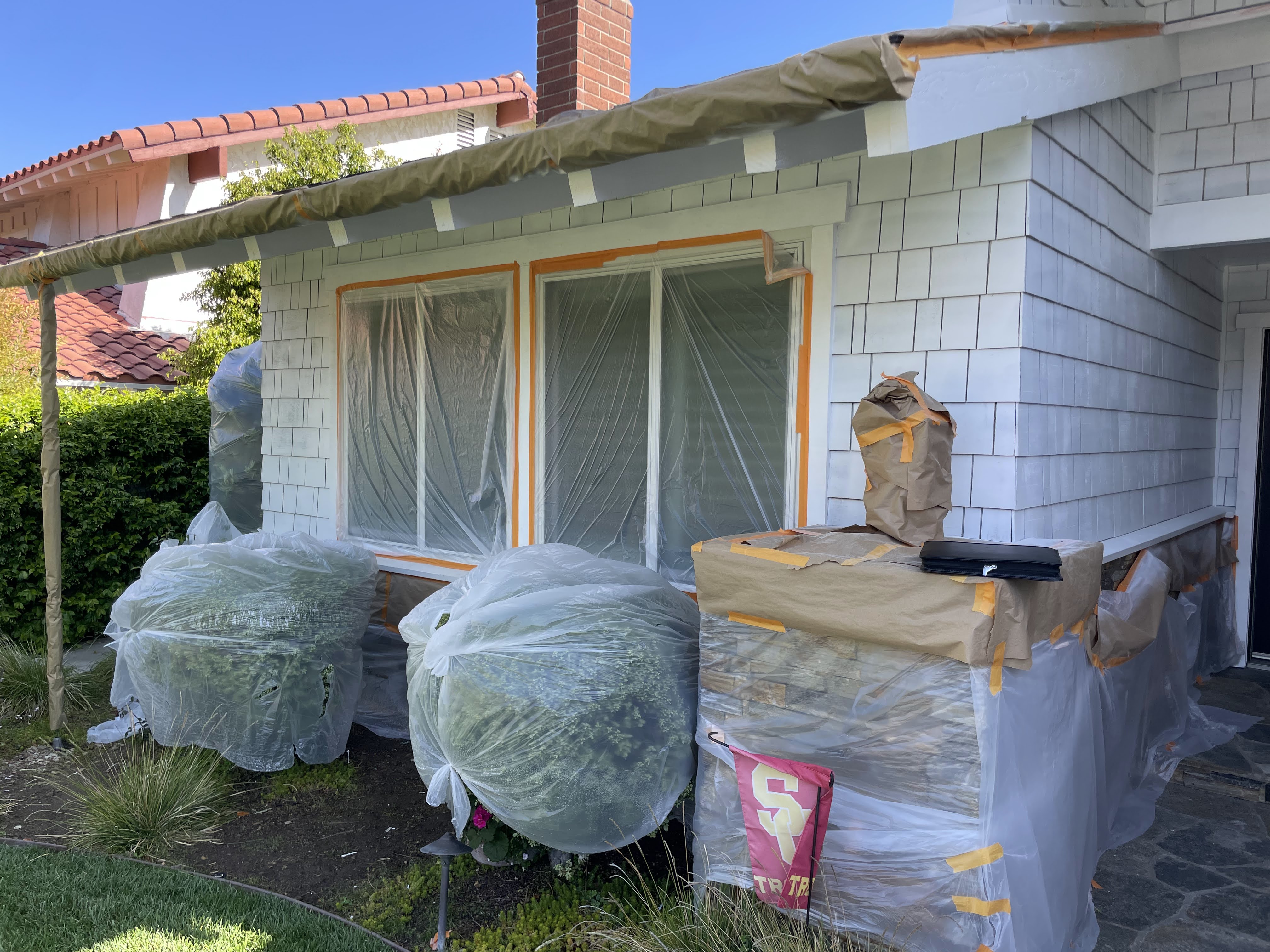 Exterior masked and prepped for a clean spray finish