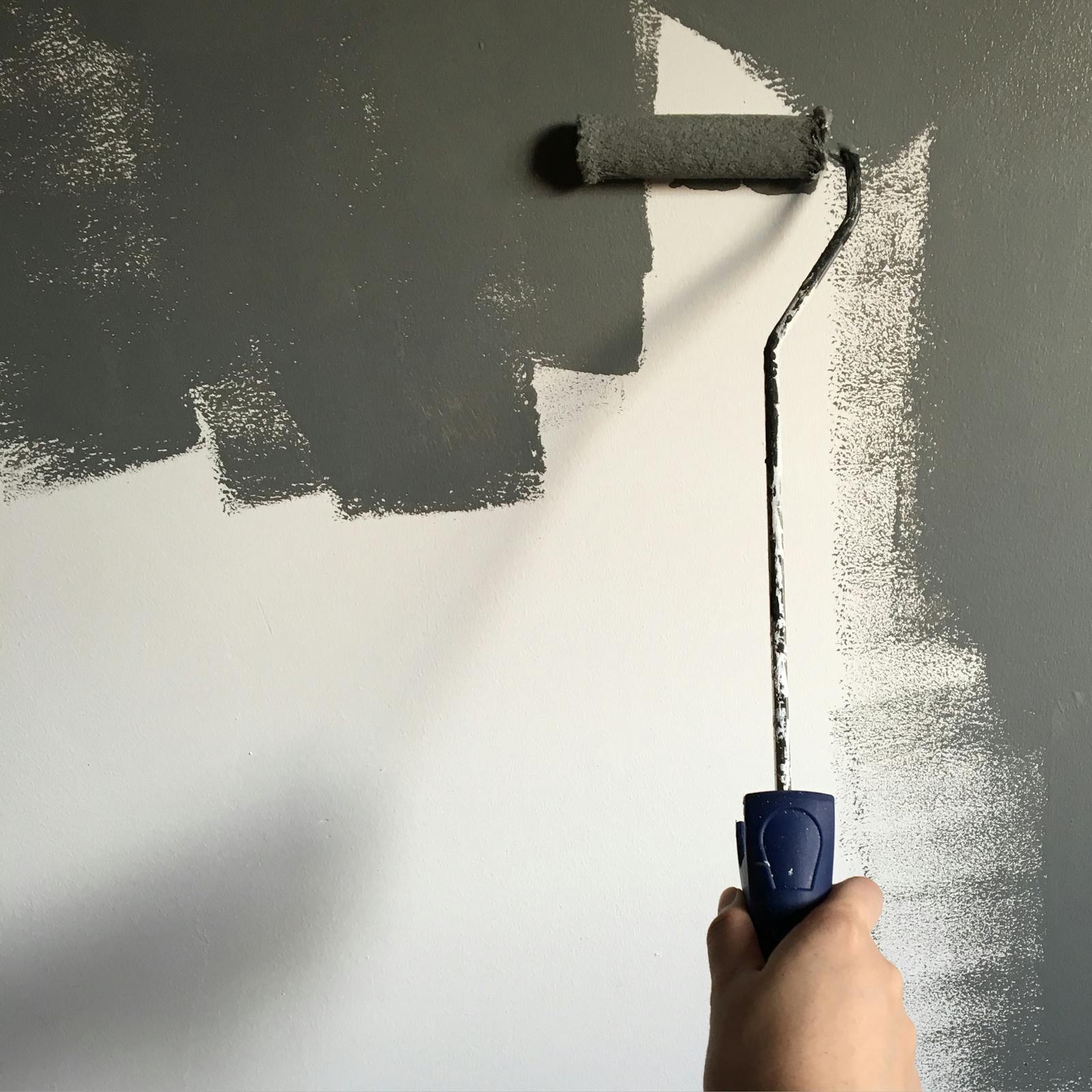 Roller laying down a smooth, even finish