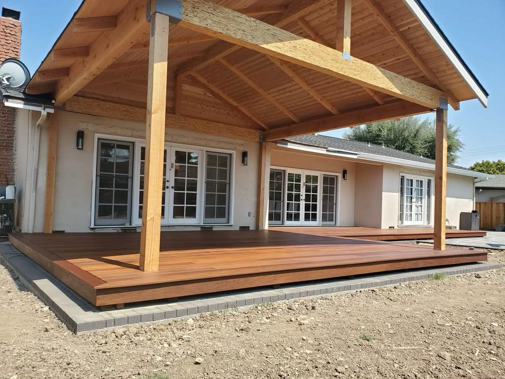 Gabled open-beam wood patio cover over a hardwood deck