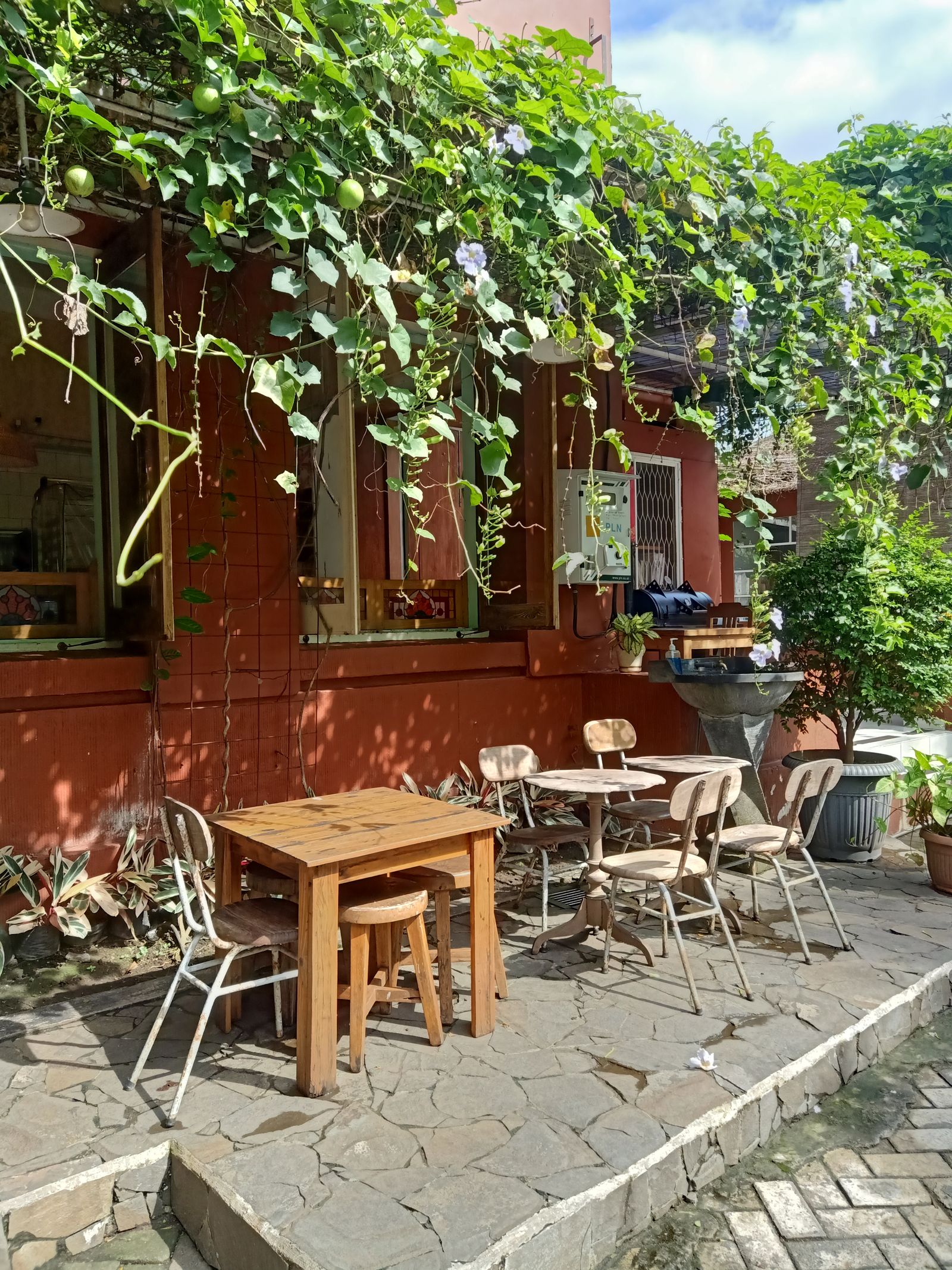 Stone-paved outdoor terrace with seating